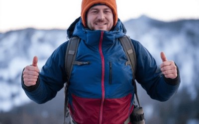 A hiker demonstrating cold weather survival layering with a base, middle, and outer layer